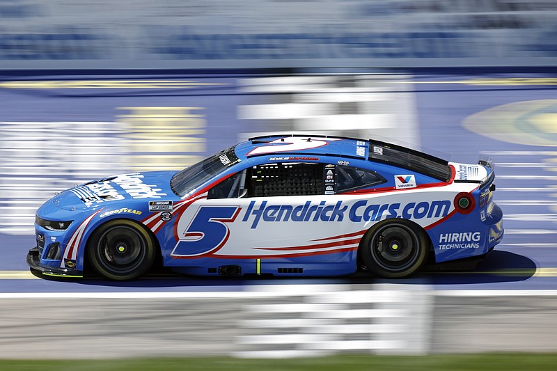 AP photo by Colin E. Braley / Pole-sitter Kyle Larson crosses the start/finish line in the Hendrick Motorsports No. 5 Chevrolet during the first stage of Sunday's NASCAR Cup Series race at Kansas Speedway.