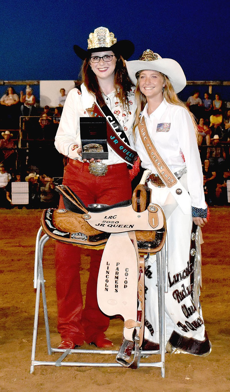 MARK HUMPHREY  ENTERPRISE-LEADER/Shania Downing, of Farmington (left), was crowned Miss Lincoln Riding Club by 2019 junior queen Savannah Perkins during Saturday's rodeo performance at the 67th annual Lincoln Rodeo.