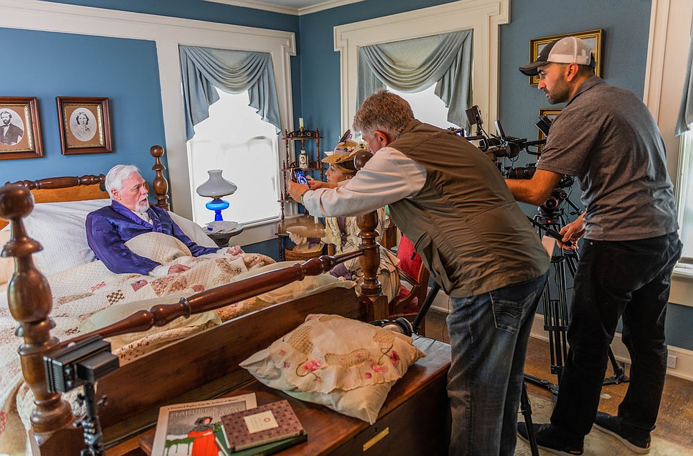 Bill Rogers and Jennica Schwartzman work on a scene from "Indians, Outlaws, Marshals and the Hangin’ Judge" as filmmaker Larry Foley (standing left) and Hayot Tuychiev, director of photography, capture the moment.
(Courtesy Photo/James Brewer)