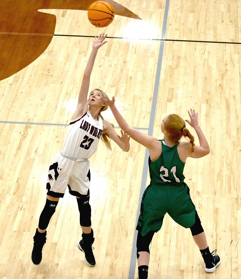 MARK HUMPHREY  ENTERPRISE-LEADER/Cowgirls battle. Two members of the Lincoln Riding Club, Lincoln sophomore Landree Cunningham (left) and Greenland sophomore Heidi Rust, find themselves dueling out of the rodeo arena and on the hardwood. Cunningham's defensive intensity, shown on this tipped in-bounds pass, was part of Lincoln coach Emilianne Slamons' tactics to wear down Greenland, which only has eight girls out for basketball. Lincoln defeated the Lady Pirates, 36-23, on Colors Day.
