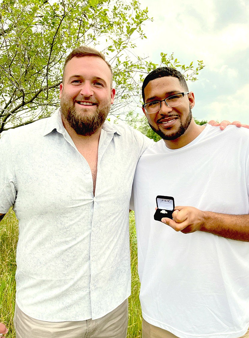 Submitted Photo/Denver Broncos guard Dalton Risner (left) partnered with Kay Jewelers to donate a Now & Forever diamond engagement ring to Will Hampton, of Wakarusa, Kan., who presented it to his finance, Stephanna Barnette. The couple, parents of 9-year-old Kaden, who's battled Leukemia ALL and is now in remission, met Risner while he was attending Kansas State. Risner took on a role as a "big brother" to Kaden and wanted to celebrate the couple's engagement.