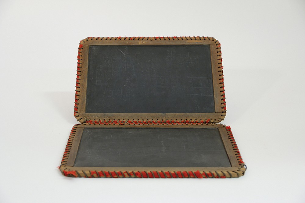 Students used wrote on slates with chalk to work on math problems or practice penmanship. (National Museum of American History)