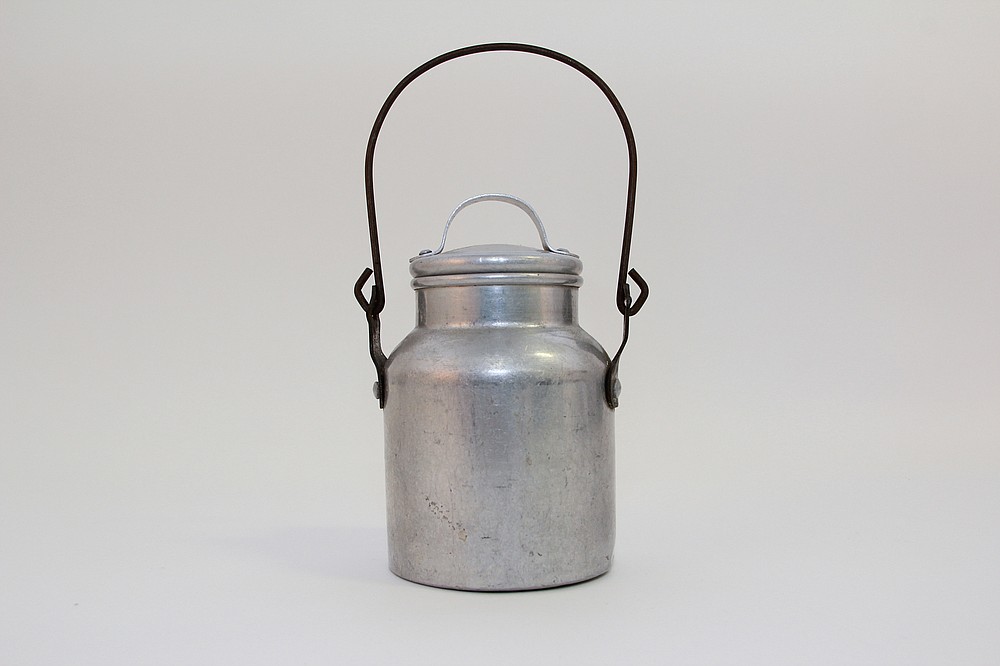 Kids at country schools brought food to eat at school. They would have used this aluminum lunch pail for milk or soup. (National Museum of American History)