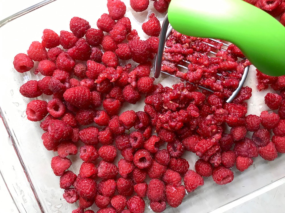Fresh raspberries are mashed in a single layer for freezer jam. (Arkansas Democrat-Gazette/Kelly Brant)