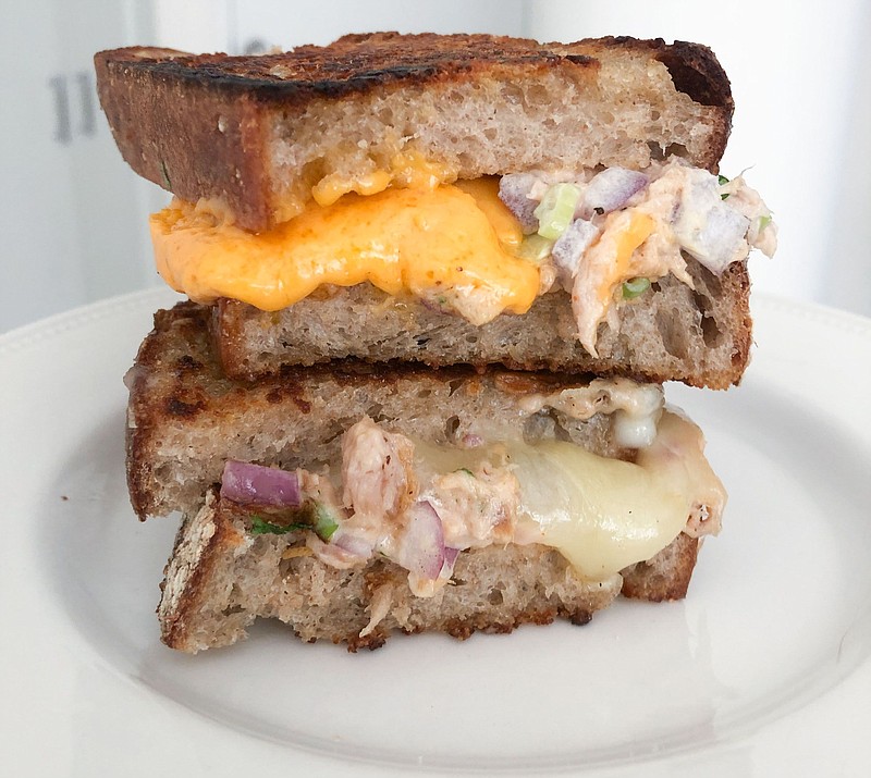 Tuna melt two ways: With cheddar and with pepper jack, which the author preferred.

(Bloomberg/Kate Krader)