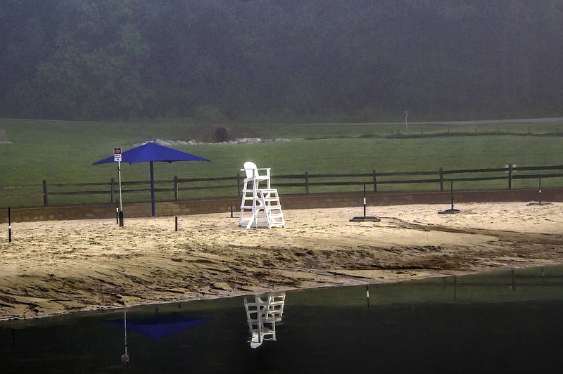 Quin Warsaw/Bella Vista Photography Club
Bella Vista's beach at Lake Avalon mirrors itself on a misty day in the city,