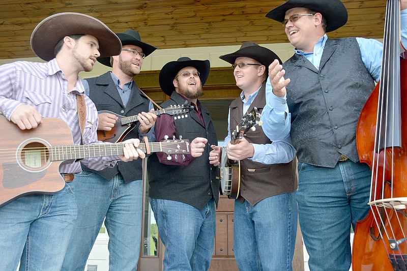 Graham Thomas/Herald-Leader
The Butler Creek Boys perform one of their favorite songs "Will the Circle Be Unbroken" in front of Brent Butler's house in east Siloam Springs. Pictured are, from left, Tanner Andrews, Nick Braschler, Dustin Butler, Austin Butler and Dillon Butler.