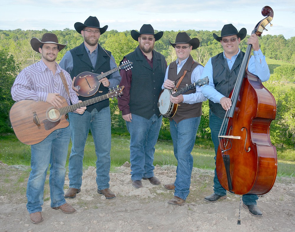 Graham Thomas/Herald-Leader
The Butler Creek Boys stand in front of Butler Creek at the home of Brent Butler. Pictured, from left, are Tanner Andrews, Nick Braschler, Dustin Butler, Austin Butler and Dillon Butler.