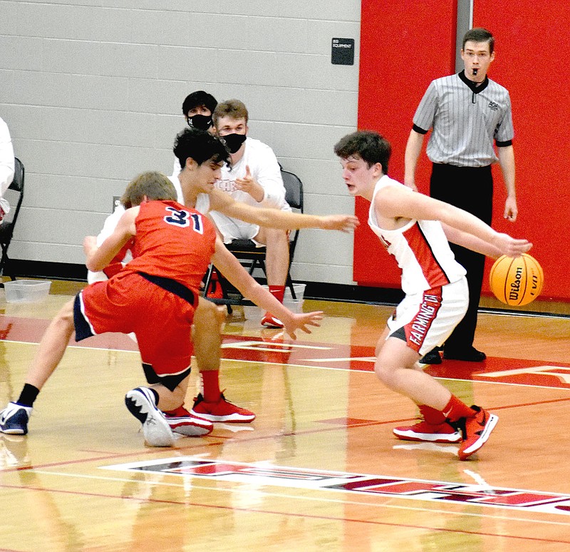 MARK HUMPHREY  ENTERPRISE-LEADER/Farmington freshman guard Layne Taylor utilizes a behind-the-back dribble against Providence Academy. The Cardinals won their season-opener, 72-53, on Thursday, Nov. 12 at Cardinal Arena.