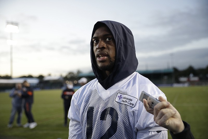 FILE - In this Oct. 4, 2019, file photo, Chicago Bears wide receiver Allen Robinson speaks to the media after an NFL training session at the Allianz Park stadium in London. Many players polled by The Associated Press over the last couple of weeks say they are scared to return to work without a cure or a vaccine for the coronavirus. By and large, however, those same players say they trust the protocols the NFL will have in place by the time practices resume and games return. (AP Photo/Matt Dunham, File)