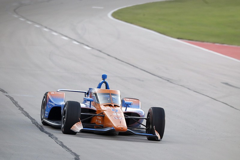 Scott Dixon heads into Turn 2 during an IndyCar auto race at Texas Motor Speedway in Fort Worth, Texas, Saturday, June 6, 2020. (AP Photo/Tony Gutierrez)
