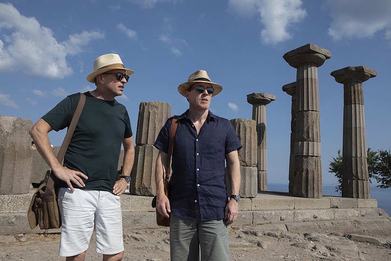 This image released by IFC Films shows Rob Brydon, right, and Steve Coogan in a scene from "The Trip to Greece." (Andy Hall/IFC Films via AP)