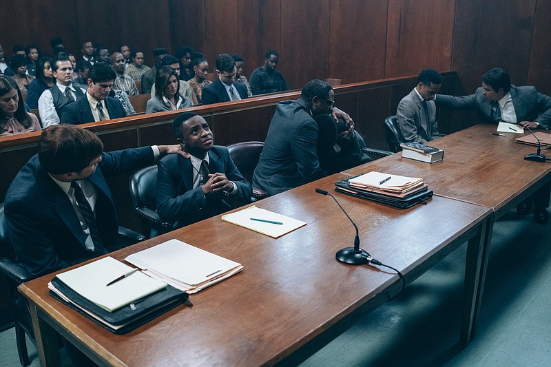 This image released by Netflix shows a scene from "When They See Us." The four-part Netflix series explores the true story of the Central Park Five, five black and Latino teenagers who were coerced into confessing to a rape they didn't commit in 1989. (Atsushi Nishijima/Netflix via AP)