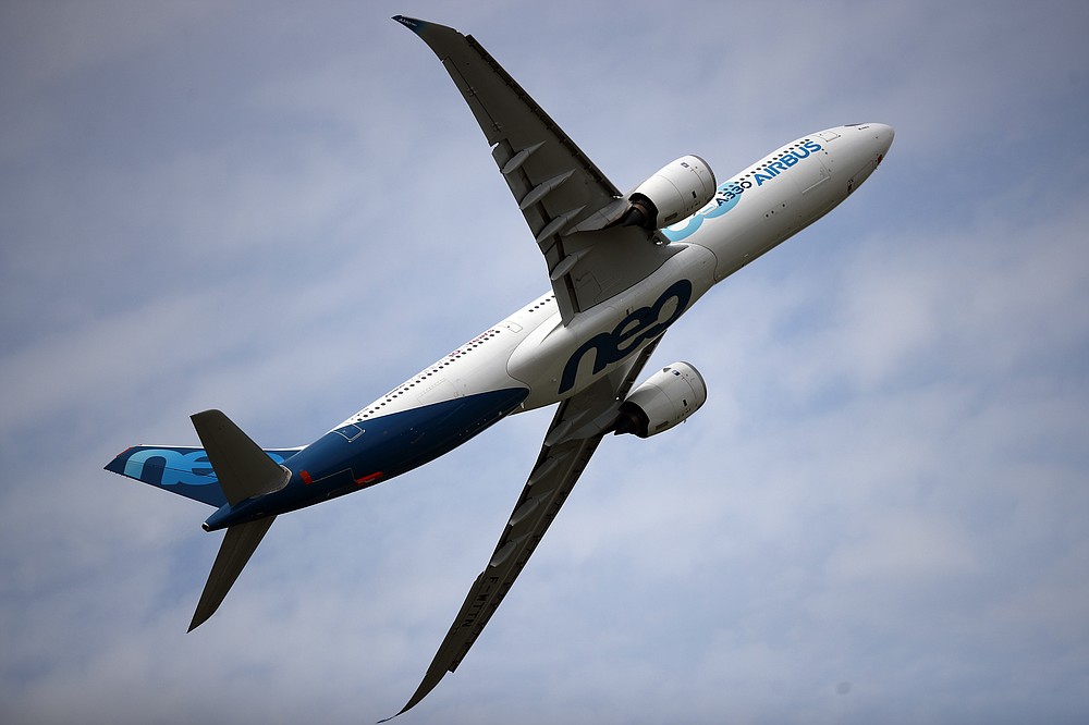 FILE - In this June 18, 2019 file photo, an Airbus A330 performs a demonstration flight at Paris Air Show, in Le Bourget, north east of Paris. France's government has announced 15 billion euros ($16.9 billion) in aid for the virus-battered aerospace industry, including plane maker Airbus and national airline Air France. (AP Photo/ Francois Mori, File)