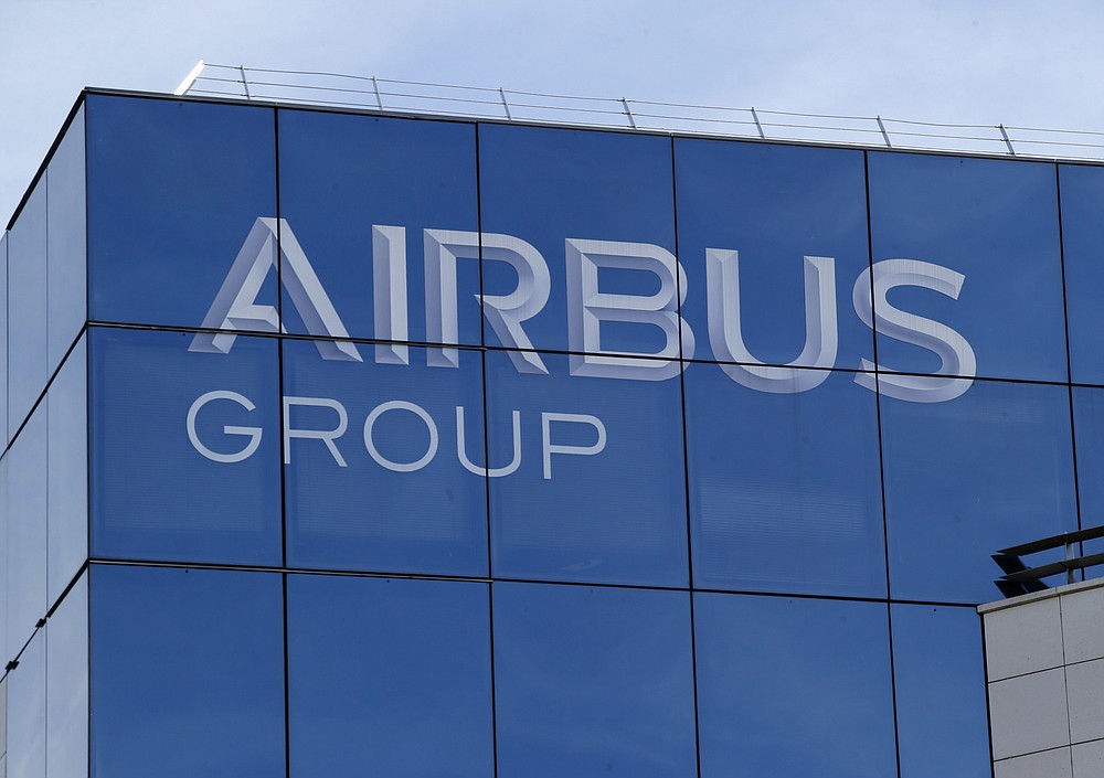 FILE - This May 6, 2016 file photo shows the logo of the Airbus Group in Suresnes, outside Paris. France's government has announced 15 billion euros ($16.9 billion) in aid for the virus-battered aerospace industry, including plane maker Airbus and national airline Air France. (AP Photo/Michel Euler, File)