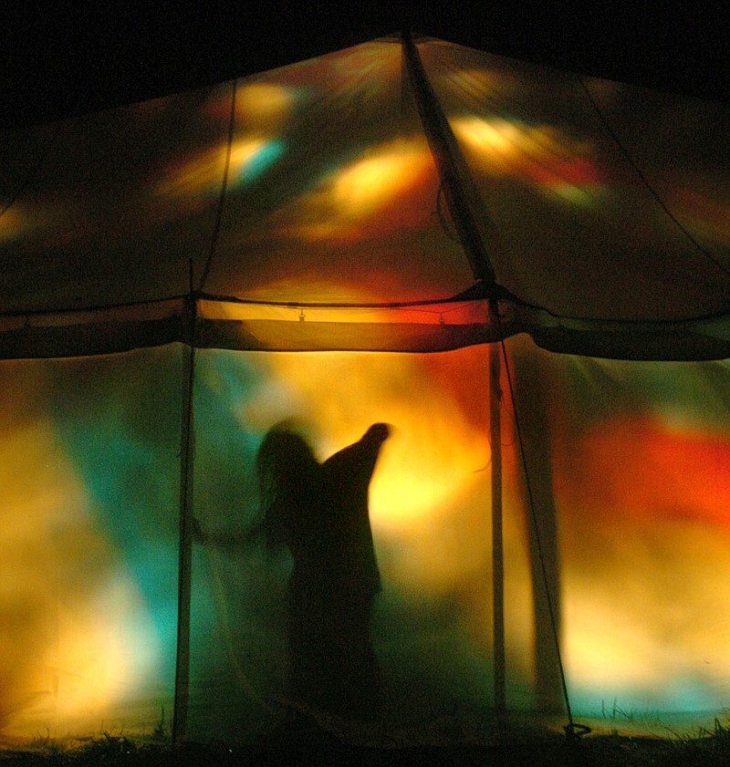 Arkansas Democrat-Gazette/MICHAEL WOODS

Spirit, a hippie from Coloumbus, Ohio, dances to the music in the late night tent at the third annual Great Unknown Music Festival Friday night at Kings River south of Eureka Springs.

10/13/04