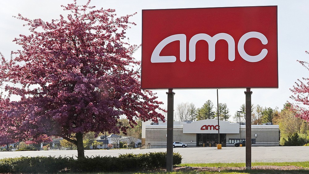 This May 14, 2020, photo shows an AMC theater sign at a nearly empty parking lot for the theater in Londonderry, N.H. After three months of near total blackout of cinemas nationwide, movie theaters are preparing to reopen - even if it means only a few titles on the marquee and showings limited to as little as 25% capacity. (AP Photo/Charles Krupa)