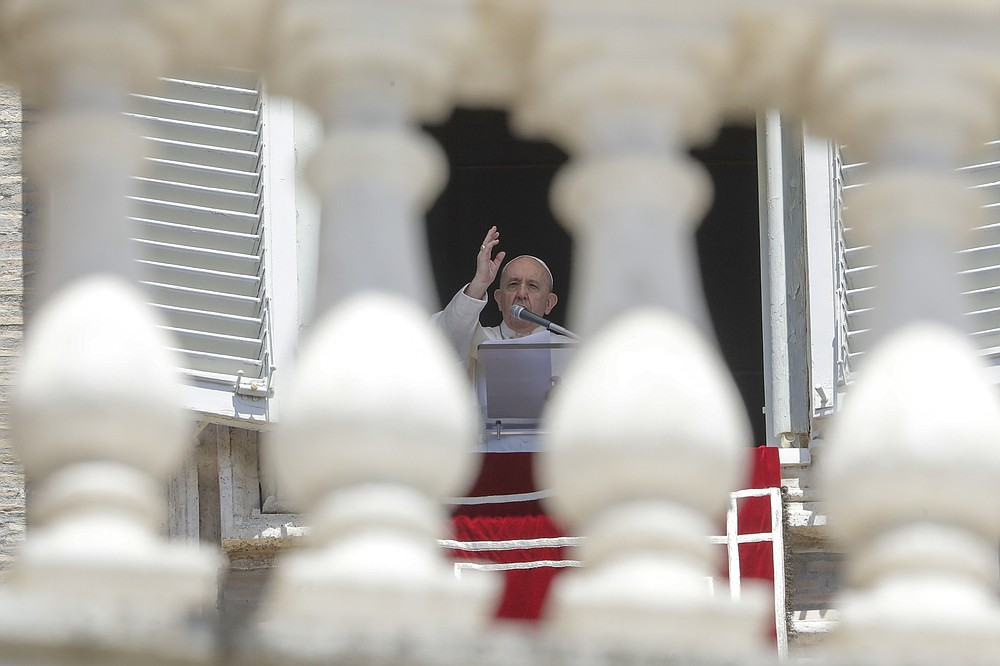 FILE - In this Sunday, June 7, 2020 file photo, Pope Francis delivers his blessing as he recites the Angelus noon prayer from the window of his studio overlooking St.Peter's Square, at the Vatican. Pope Francis and cardinals have preached, tweeted and spoken out about his death, and the Vatican’s communications juggernaut has gone into overdrive to draw attention to the cause. George Floyd’s killing at the hands of a white police officer and the global protests that erupted to denounce police brutality and racism might normally have drawn a muted diplomatic response from the Holy See. (AP Photo/Andrew Medichini, File)