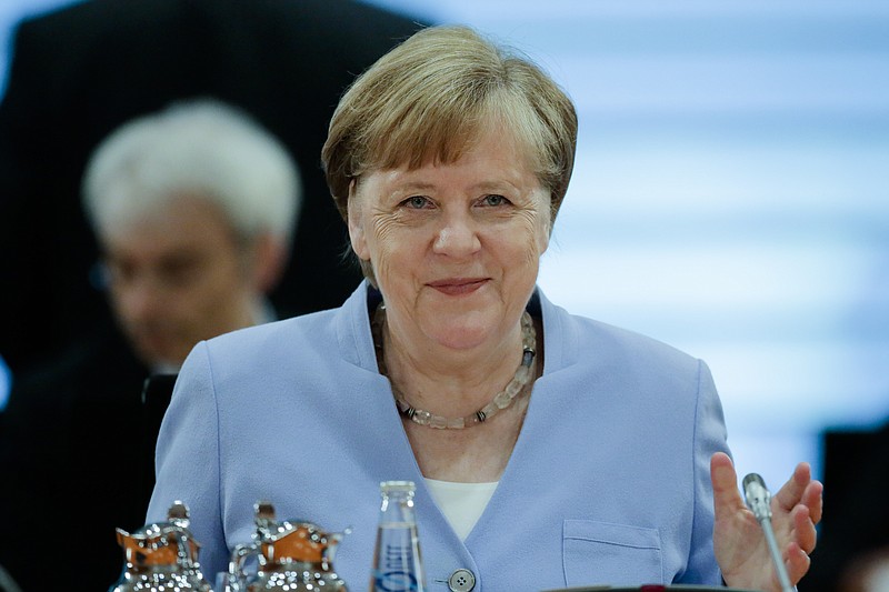 German Chancellor Angela Merkel attends a special cabinet meeting of the German government about the a stimulus program to booster the German economy after the coronavirus lockdown, at the chancellery in Berlin, Germany, Friday, June 12, 2020. (AP Photo/Markus Schreiber, Pool)