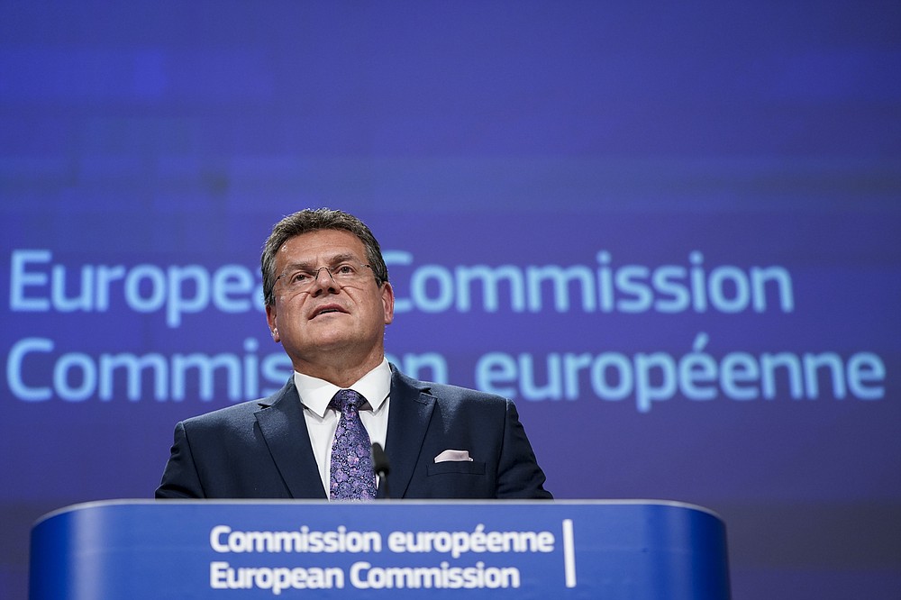 European Energy Commissioner Maros Sefcovic addresses a video press conference following a meeting of the EU-UK Joint Committee on Brexit at the EU headquarters in Brussels, Friday, June 12, 2020. The British government said Friday it will delay bringing in full border checks on goods coming from the European Union to relieve pressure on businesses hammered by the coronavirus pandemic. (Kenzo Tribouillard, Pool Photo via AP)