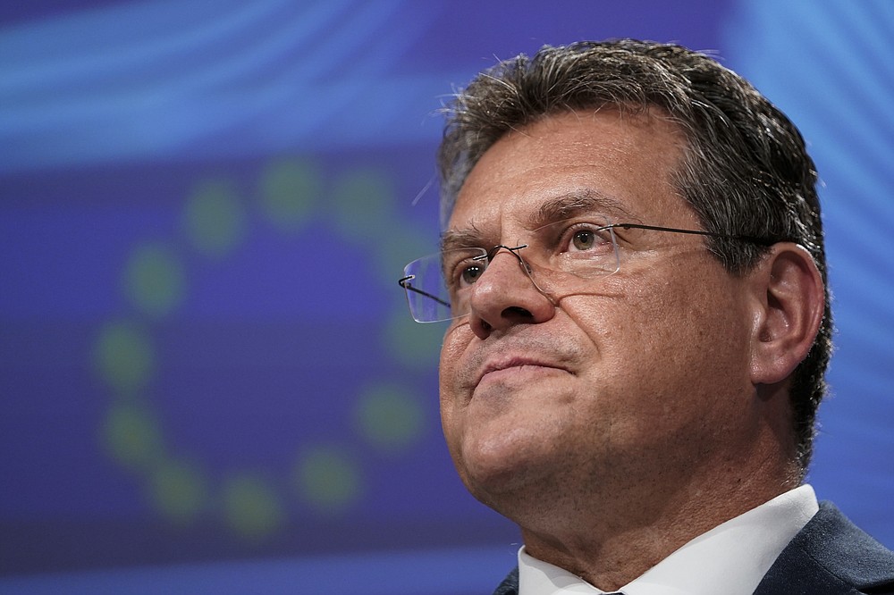 European Energy Commissioner Maros Sefcovic addresses a video press conference following a meeting of the EU-UK Joint Committee on Brexit at the EU headquarters in Brussels, Friday, June 12, 2020. The British government said Friday it will delay bringing in full border checks on goods coming from the European Union to relieve pressure on businesses hammered by the coronavirus pandemic. (Kenzo Tribouillard, Pool Photo via AP)