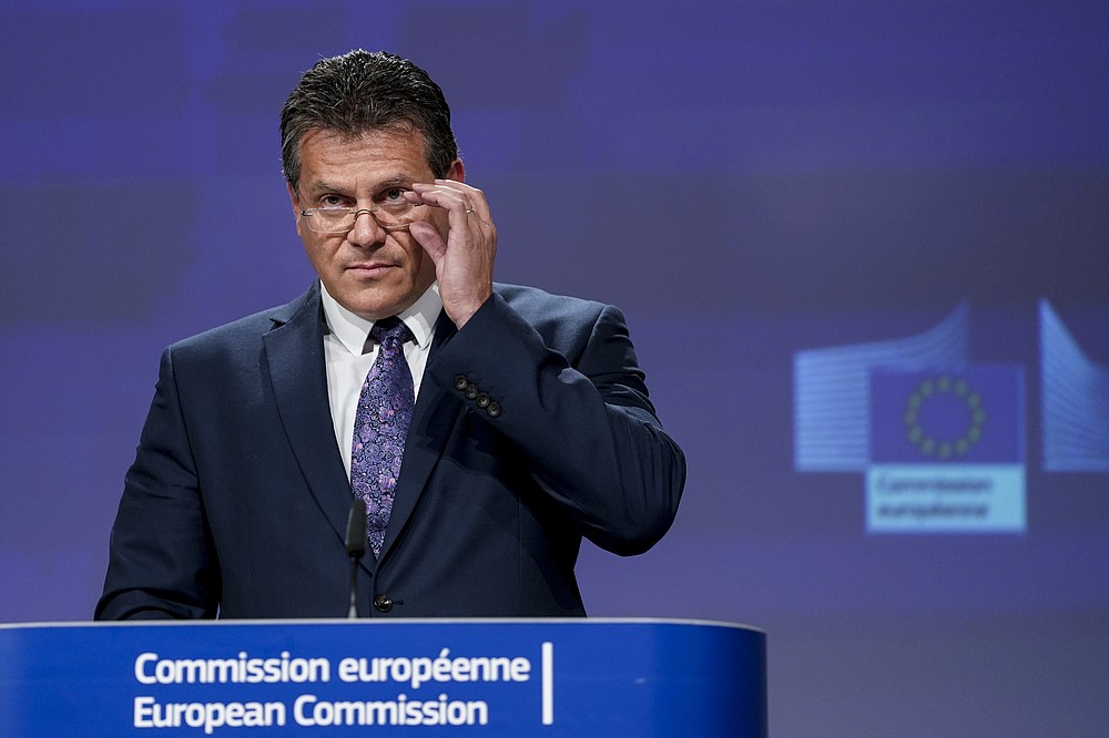 European Energy Commissioner Maros Sefcovic addresses a video press conference following a meeting of the EU-UK Joint Committee on Brexit at the EU headquarters in Brussels, Friday, June 12, 2020. The British government said Friday it will delay bringing in full border checks on goods coming from the European Union to relieve pressure on businesses hammered by the coronavirus pandemic. (Kenzo Tribouillard, Pool Photo via AP)