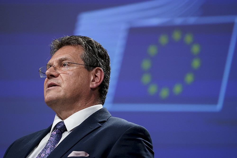 European Energy Commissioner Maros Sefcovic addresses a video press conference following a meeting of the EU-UK Joint Committee on Brexit at the EU headquarters in Brussels, Friday, June 12, 2020. The British government said Friday it will delay bringing in full border checks on goods coming from the European Union to relieve pressure on businesses hammered by the coronavirus pandemic. (Kenzo Tribouillard, Pool Photo via AP)