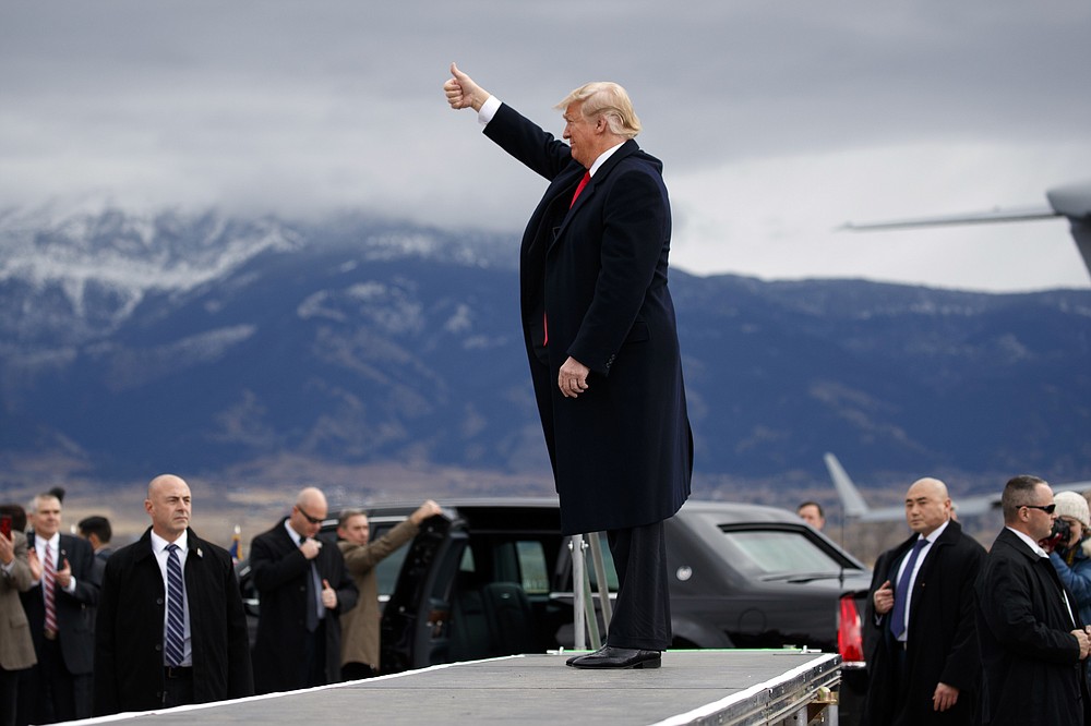 FILE - In this Nov. 3, 2018, file photo President Donald Trump arrives for a campaign rally at Bozeman Yellowstone International Airport in Belgrade, Mont. (AP Photo/Evan Vucci, File)