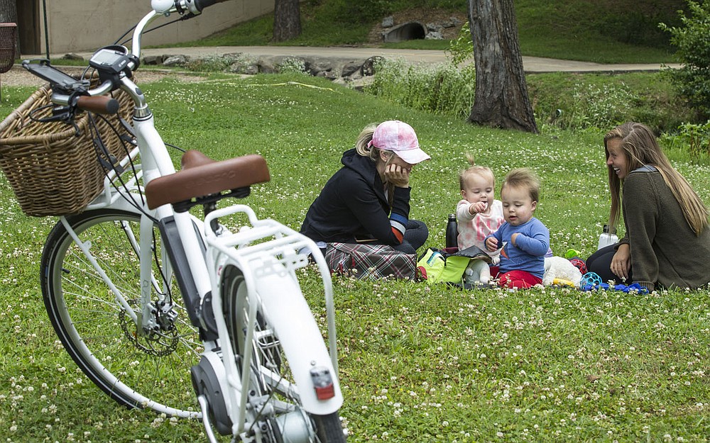 Mallory Breeden (from left), twins Kennedy Breeden and Knox Breeden, 1, and Sarah Schuette, all of Bentonville, take a break Wednesday, June 10, 2020, at Horsebarn Trailhead Park in Rogers during a bike ride on the hard-surface trails. Go to nwaonline.com/200612Daily to see more photos.
(NWA Democrat-Gazette/Ben Goff)