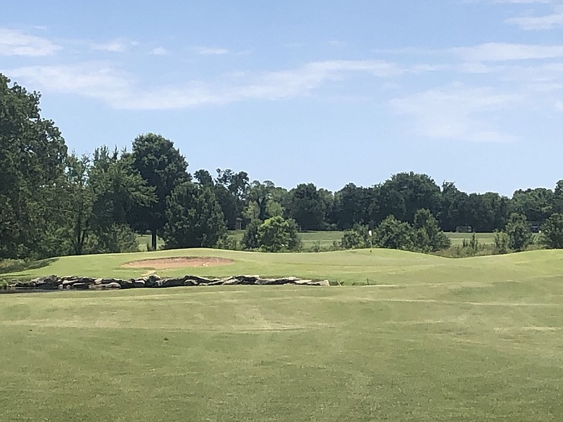 RICK PECK/SPECIAL TO MCDONALD COUNTY PRESS The 14th hole at Patricia Island Golf Course requires a second shot over a pond and bunker guarding the green.