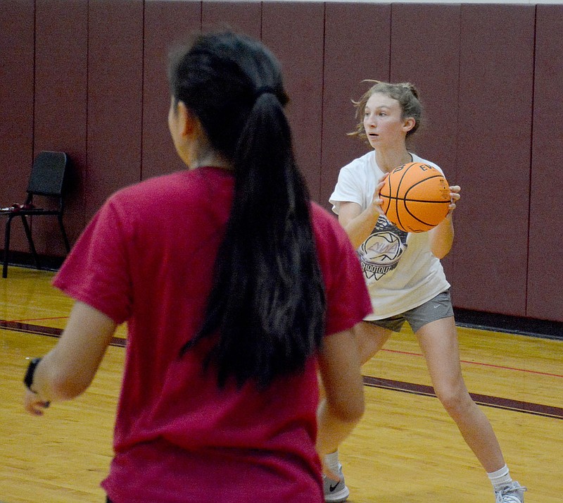 Graham Thomas/Herald-Leader
Siloam Springs sophomore Cailee Johnson looks to pass the ball during girls basketball practice Monday inside the Panther Den.