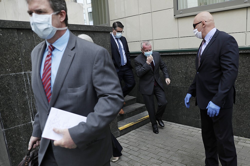 U.S. Ambassador to Russia John Sullivan, 2nd right, leaves the Moscow City Court building after the verdict announcement for American Paul Whelan in Moscow, Russia, Monday, June 15, 2020. The Moscow City Court on Monday convicted Paul Whelan on charges of espionage and sentenced him to 16 years in maximum security prison colony. Whelan has insisted on his innocence, saying he was set up. The U.S. Embassy has denounced Whelan's trial as unfair, pointing that no evidence has been provided. (AP Photo/Pavel Golovkin)