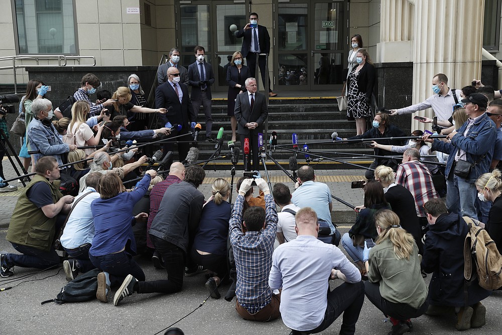 U.S. Ambassador to Russia John Sullivan speaks to the media at the Moscow City Court building after the verdict announcement for American Paul Whelan in Moscow, Russia, Monday, June 15, 2020. The Moscow City Court on Monday convicted Paul Whelan on charges of espionage and sentenced him to 16 years in maximum security prison colony. Whelan has insisted on his innocence, saying he was set up. The U.S. Embassy has denounced Whelan's trial as unfair, pointing that no evidence has been provided. (AP Photo/Pavel Golovkin)
