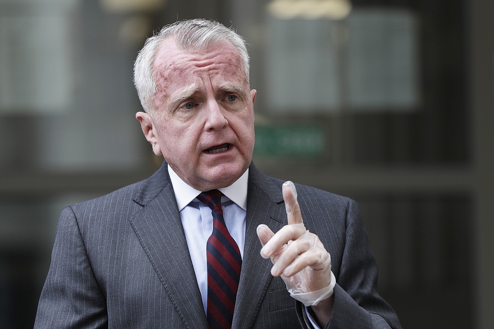 U.S. Ambassador to Russia John Sullivan speaks to the media at the Moscow City Court building after the verdict announcement for American Paul Whelan in Moscow, Russia, Monday, June 15, 2020. The Moscow City Court on Monday convicted Paul Whelan on charges of espionage and sentenced him to 16 years in maximum security prison colony. Whelan has insisted on his innocence, saying he was set up. The U.S. Embassy has denounced Whelan's trial as unfair, pointing that no evidence has been provided. (AP Photo/Pavel Golovkin)