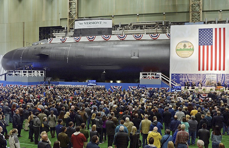 FILE - This Oct. 20, 2018 file photo shows the christening of the Navy's nuclear-powered attack submarine USS Vermont at General Dynamics Electric Boat in Groton, Conn. For decades, the Navy's leading supplier of high-strength steel for submarines provided subpar metal because one of the company's longtime employees falsified lab results, putting sailors at greater risk in the event of collisions or other impacts, federal prosecutors said in court filings Monday, June 15, 2020. The supplier, Kansas City-based Bradken Inc., paid $10.9 million as part of a deferred prosecution agreement, the Justice Department said. The company provides steel castings that Navy contractors Electric Boat and Newport News Shipbuilding use to make submarine hulls. The government did not disclose which subs were affected. (Sean D. Elliot/The Day via AP, File) story.lead_photo.caption