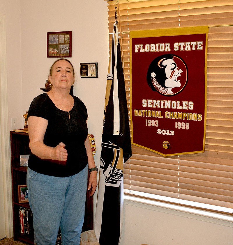 Marc Hayot/Herald-Leader During her time at Florida State University, Robbie Castleman became a rabid Seminole fan. She even learned how to do the famous tomahawk chop.