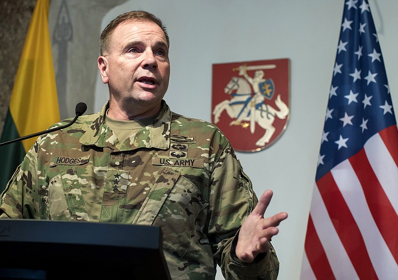 FILE - In this Wednesday, March 1, 2017 file photo then Commander of U.S. Army Europe Lt. Gen. Ben Hodges speaks during a news conference following a meeting with Lithuanian Minister of National Defense Raimundas Karoblis in Vilnius, Lithuania. After more than a year of thinly veiled threats that the United States could start pulling troops out of Germany unless the country increases its defense spending to NATO standards, President Donald Trump appears to be going ahead with the hardball approach with a plan to reduce the American military presence in the country by more than percent. (AP Photo/Mindaugas Kulbis, file)