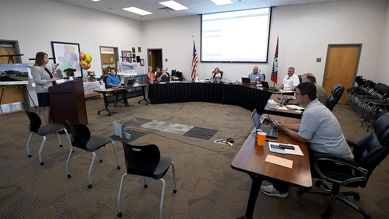 NWA Democrat-Gazette/DAVE PEROZEK The Bentonville School Board listens to Jennifer Morrow, director of secondary education, discuss options for graduation ceremonies for the district's two high schools next month.