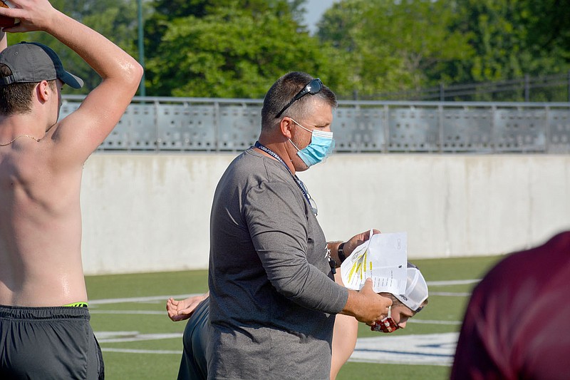 Graham Thomas/Herald-Leader
Siloam Springs head football coach Brandon Craig goes over plays during a morning workout session in June. The Panthers are off this week but are scheduled to resume morning workouts on Monday, July 6.