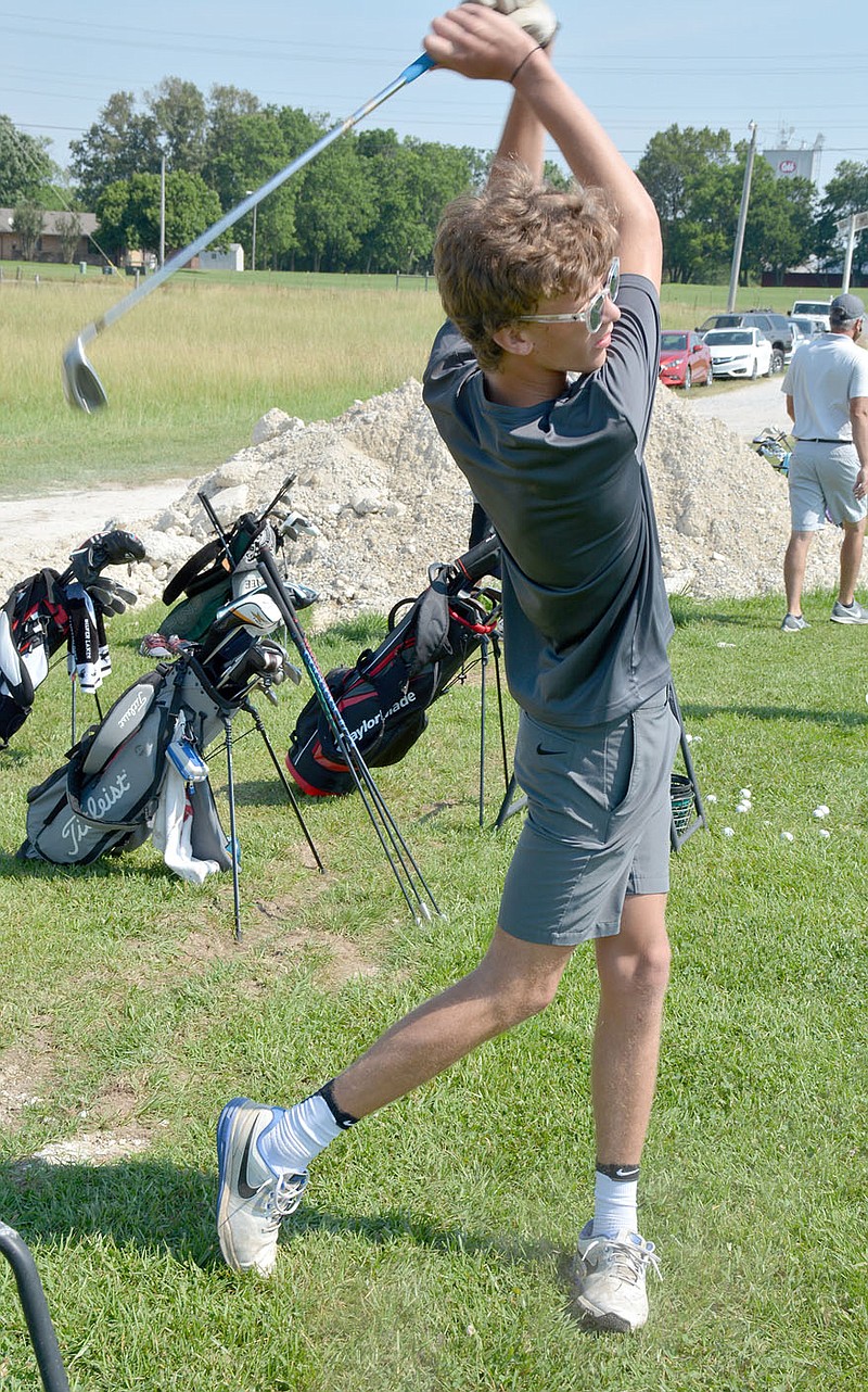 Graham Thomas/Siloam Sunday
Siloam Springs senior golfer Breck Soderquist follows through with his swing after taking a hit on the driving range during golf practice Tuesday at Siloam Springs Rodeo Grounds.