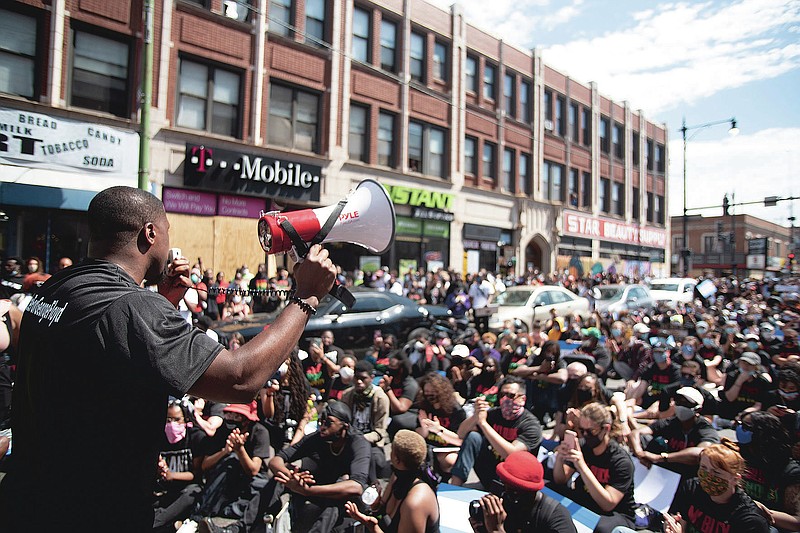 Jahmal Cole, founder of My Block, My Hood, My City, speaks Sunday, June 7, 2020, during a peace march and food give-away organized by his nonprofit group in Chicago. "I want to make sure we're protesting by calling our local officials. I want to make sure we're protesting by going to the school board. There's other ways to protest," he told the crowd. (Photo via Colin Boyle/MBMHC)