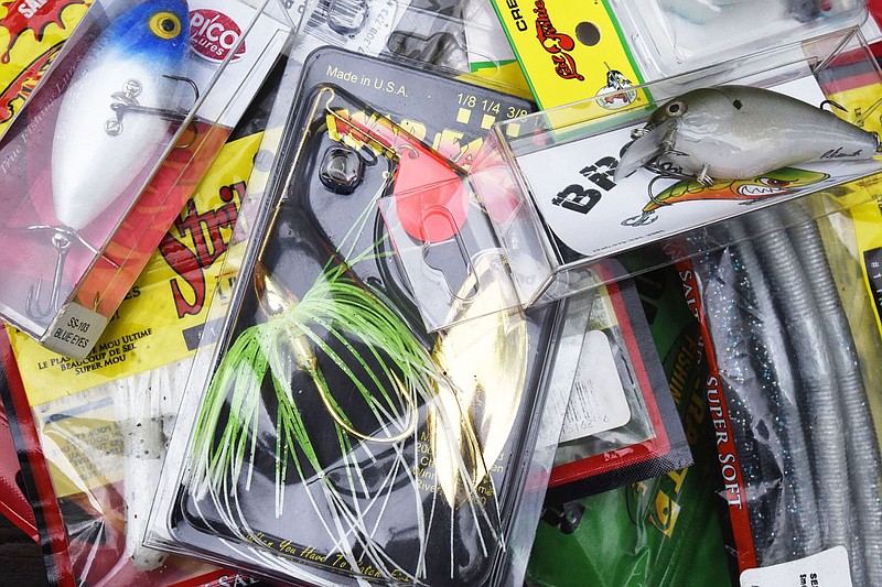 George Rowland not only basks in fish-story fame by winning the contest, he won a fine selection of lures almost guaranteed to catch the big ones at his favorite fishing holes.
(NWA Democrat-Gazette/Flip Putthoff)