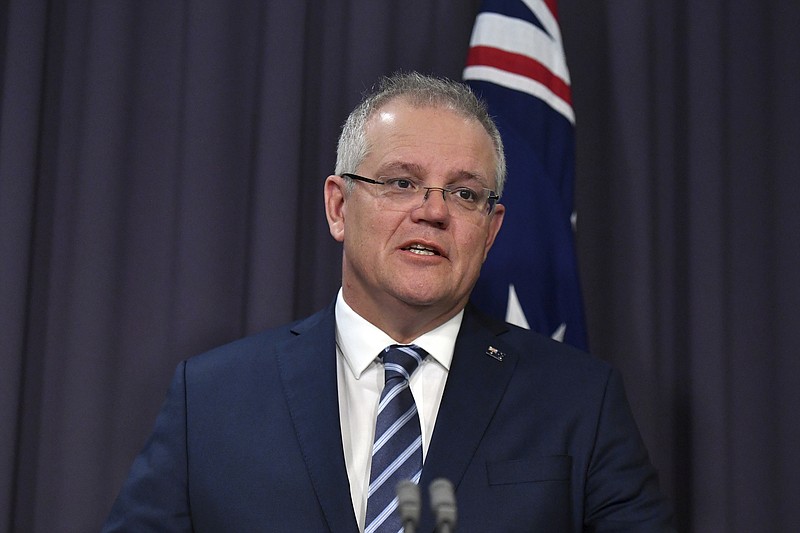 Australian Prime Minister Scott Morrison speaks at a press conference at Parliament House in Canberra, Friday, June 19, 2020. Australia is under increasing cyberattack from a “sophisticated state-based cyber actor,” Morrison said Friday. (Mick Tsikas/AAP Image)