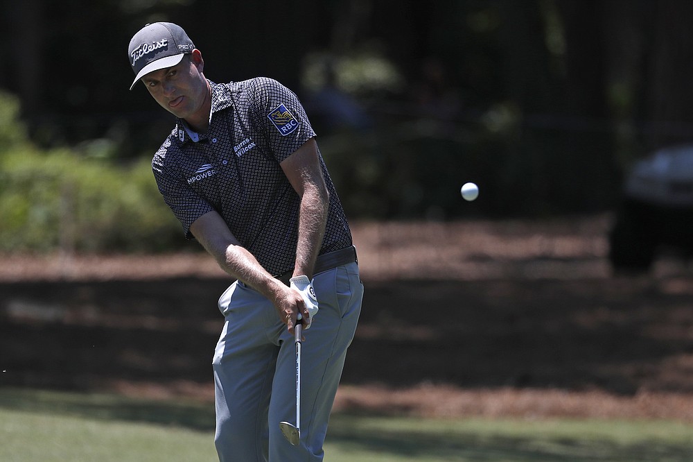 Webb Simpson chips onto the first green during the third round of the RBC Heritage golf tournament, Saturday, June 20, 2020, in Hilton Head Island, S.C. (AP Photo/Gerry Broome)