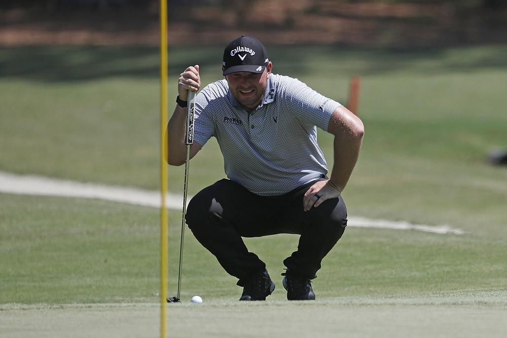 Matthew NeSmith lines up a putt on the eighth green during the third round of the RBC Heritage golf tournament, Saturday, June 20, 2020, in Hilton Head Island, S.C. (AP Photo/Gerry Broome)