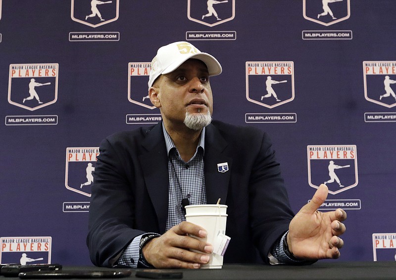 FILE - In this Feb. 19, 2017, file photo, Major League Players Association Executive Director Tony Clark, answers questions at a news conference in Phoenix. Commissioner Rob Manfred says there might be no major league season after a breakdown in talks between teams and the union on how to split up money in a season delayed by the coronavirus pandemic. The league also said several players have tested positive for COVID-19. Two days after union head Clark declared additional negotiations futile, Deputy Commissioner Dan Halem sent a seven-page letter to players' association chief negotiator Bruce Meyer asking the union whether it will waive the threat of legal action and tell MLB to announce a spring training report date and a regular season schedule. (AP Photo/Morry Gash, File)