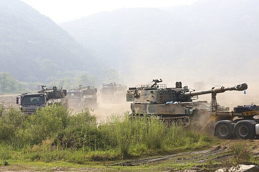 South Korean army's K-55 self-propelled howitzers loading on vehicles are moved in Paju, near the border with North Korea, South Korea, Wednesday, June 17, 2020. North Korea said Wednesday it will redeploy troops to now-shuttered inter-Korean tourism and economic sites near the border with South Korea and take other steps to nullify landmark 2018 tension-reduction deals. (AP Photo/Ahn Young-joon)
