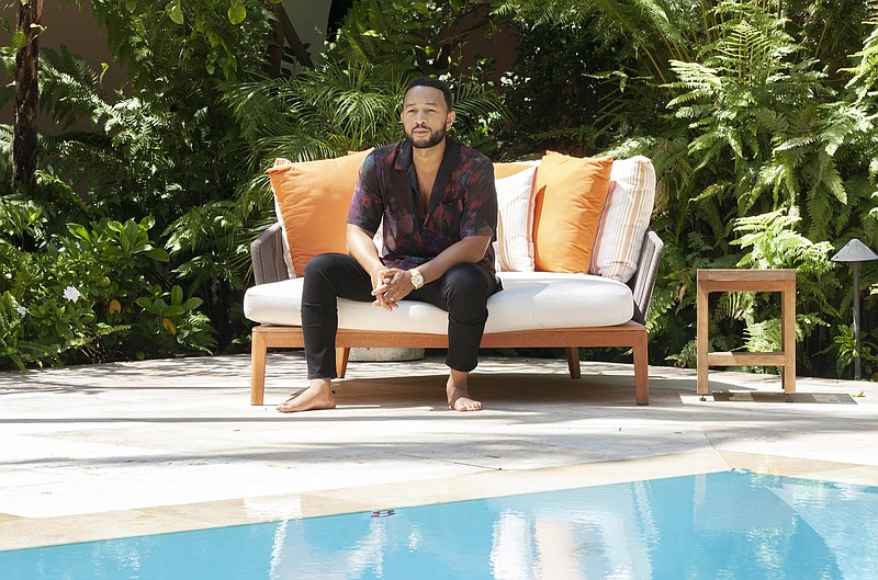 Singer-songwriter John Legend poses by the pool at The Bel Air Hotel in Beverly Hill, Calif., to promote his latest album “Bigger Love.”
(AP/INVISION/REBECCA CABAGE) story.lead_photo.caption