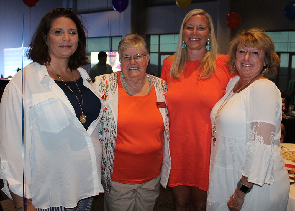 NWA Democrat-Gazette/CARIN SCHOPPMEYER Julie Parker, Faye Jones, Ashley Jones, Tina Brewer help support Children's House on June 15.