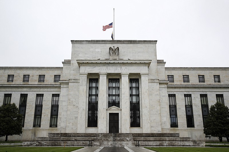 FILE - This May 22, 2020 photo shows the Federal Reserve building in Washington. The Federal Reserve and four other bank regulatory agencies announced on Thursday, June 25, that they have finalized a rule that will ease restrictions curtailing the ability of banks to make investments in such areas as hedge funds. The announcement of the easing of regulations know as the āVolcker Ruleā gave an immediate boost to bank stocks because the rule change could free up billions of dollars in capital in the banking industry.(AP Photo/Patrick Semansky, File) story.lead_photo.caption